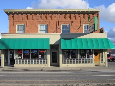 Facing the building on the Southeast corner of Sharp Avenue.