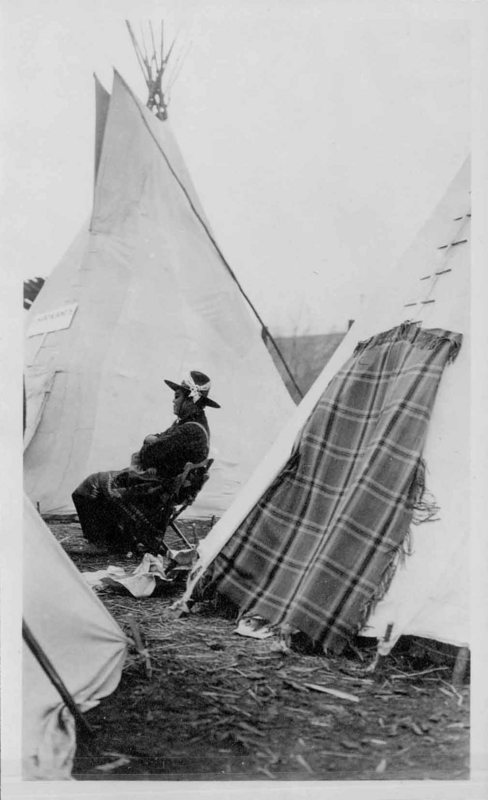 Sitting In Front of a Tipi