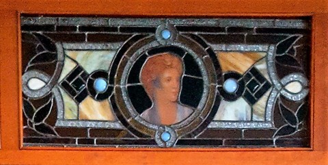 A stain glass window of Susan Glover.