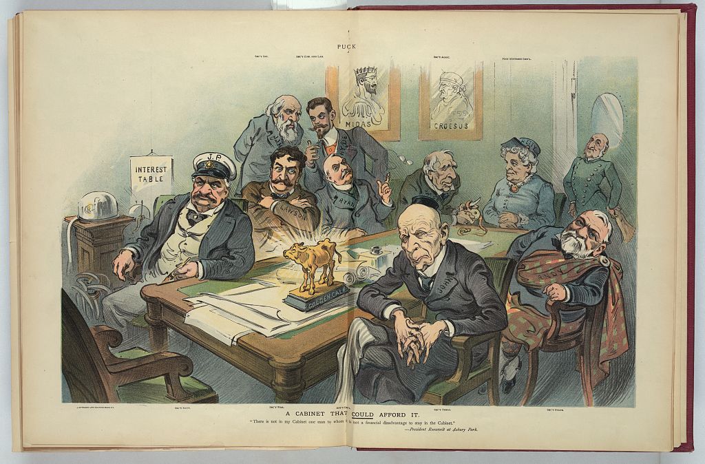 A political cartoon in color showing a cabinet consisting of the richest people of the day, depicted in unflattering caricature. They sit around a table that has a golden calf statue on it, and the background has a stock ticker, interest table, and portraits of Midas and Croesus.